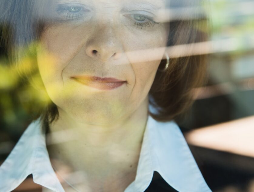 Portrait of business woman reading SMS
